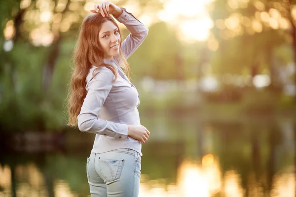 Romantic young girl outdoors enjoying nature Beautiful Model in — Stockfoto