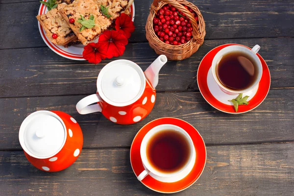 Tea cups top view. Tea time for party. Tea set red polka-dot, co — Stock Photo, Image