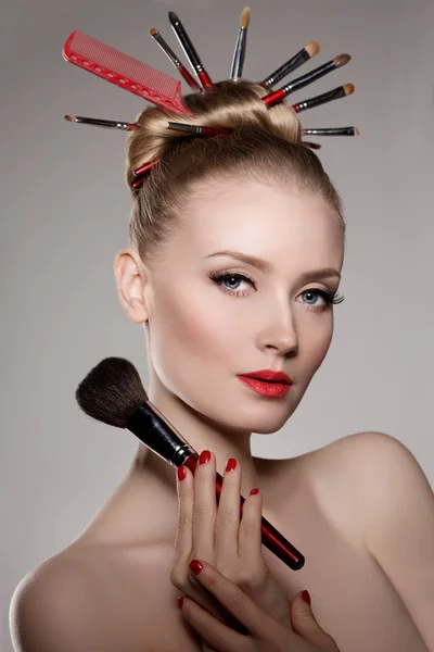 Beauty young girl model stylist with brushes in volume hairstyle — Stock Photo, Image