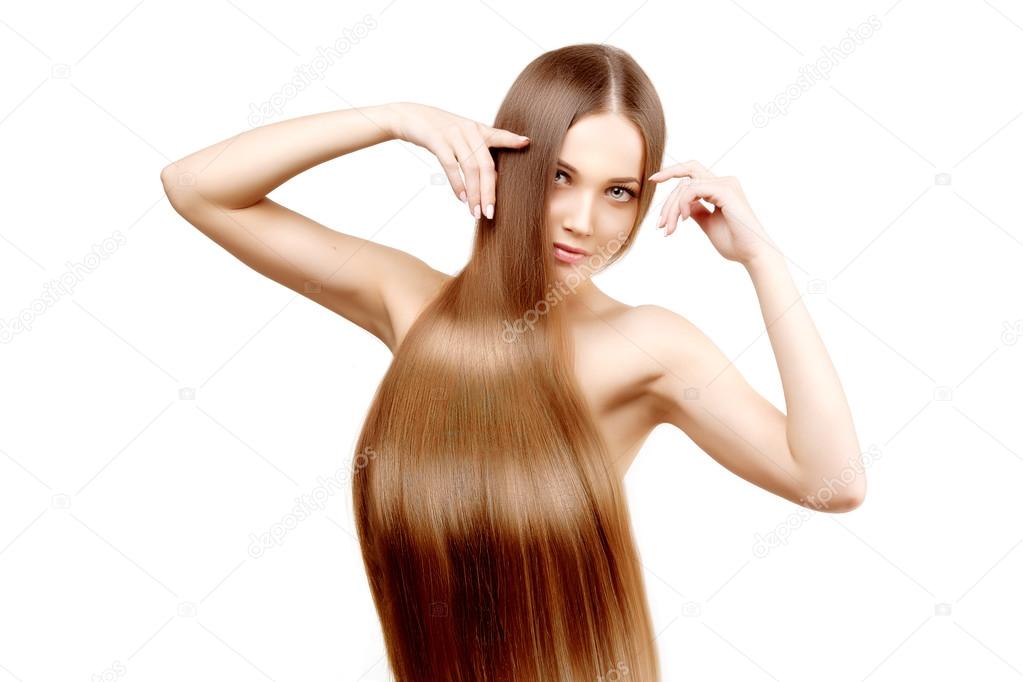 Long hair. Hairstyle. Hair Salon. Fashion model with shiny hair.