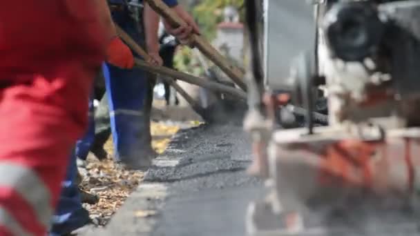 Asphalt paver applying asphalt on the way — Stock Video