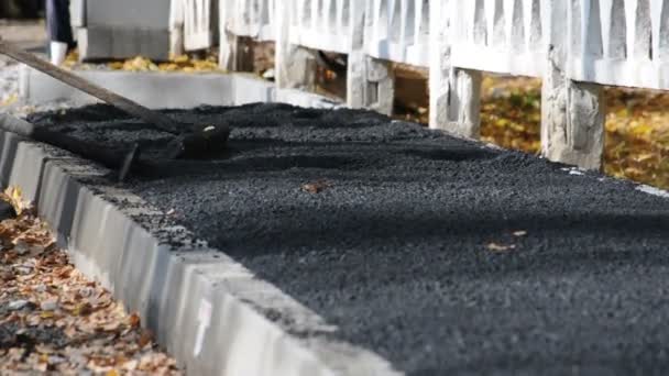 Asphalt paver applying asphalt on the way