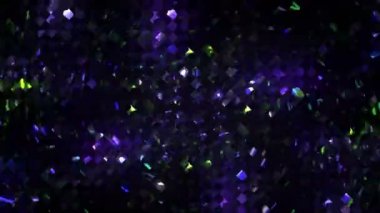 Karmaşık geometrik şekillerin parıldayan mozaiği merkezin etrafında hızla dönüyor. Parçacıkların ve renkli dalgaların renk paleti. Müzik ve dinamik sunum videoları için parlak bir arkaplan olarak kullanılabilir. Döngülü