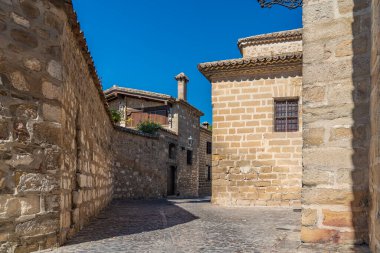 Old stoned alley in Baeza medieval city, declared along with Ubeda as world heritage by unesco, Andalusia, Spain