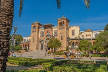 SEVILLE SPAIN, OCTOBER 17. 2020: The Plaza de America and the Museum of Popular Arts in Seville, Andalusia, Spain. Parque de Maria Luisa.