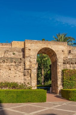 Real Alcazar arch door of Sevilla, Andalusia Spain with beautiful blue sky