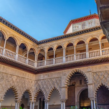 Palace of Alcazar in Seville, Famous Andalusian Architecture. Old Arab Palace in Seville, Spain. Ornamented Arch and Column.