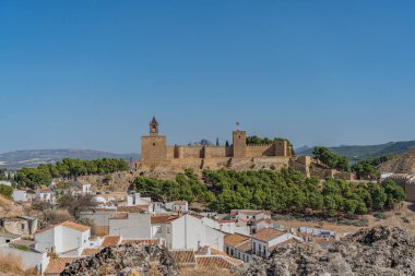 Antequera, Spain October 2020: Moorish castle alcazaba in Antequera with townhouses, Andalusia Spain