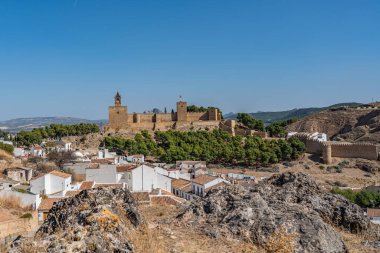 Antequera, Spain October 2020: Moorish castle alcazaba in Antequera with townhouses, Andalusia Spain