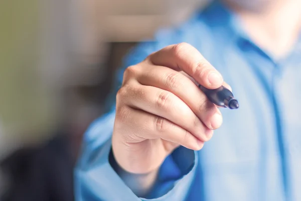 Businessman writes on the whiteboard — Stock Photo, Image