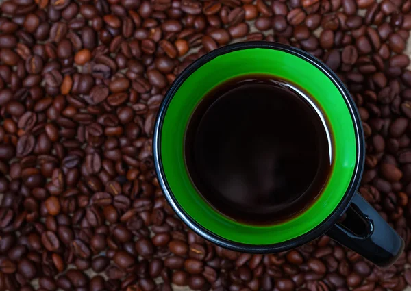 Cup of coffee and coffee beans — Stock Photo, Image