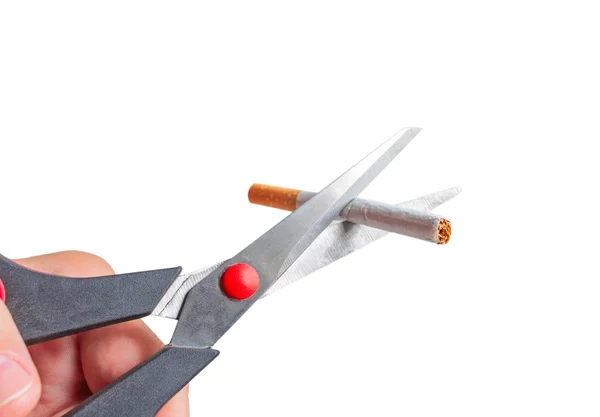 Man cuts a cigarette with scissors — Stock Photo, Image