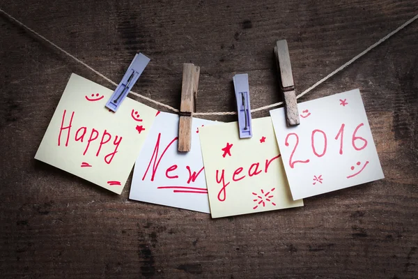 Cartão de Feliz Ano Novo em fundo de madeira — Fotografia de Stock