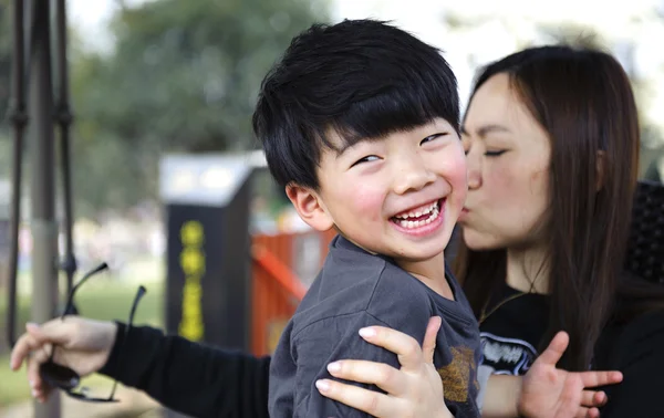 Playing boy and his mother — Stock Photo, Image