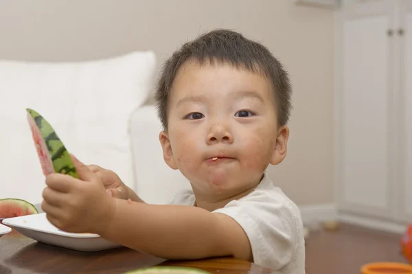 Baby eating watermelon — Stock Photo, Image