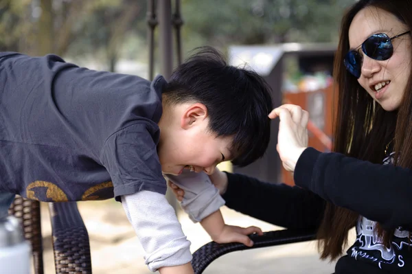 Playing boy and his mother — Stock Photo, Image