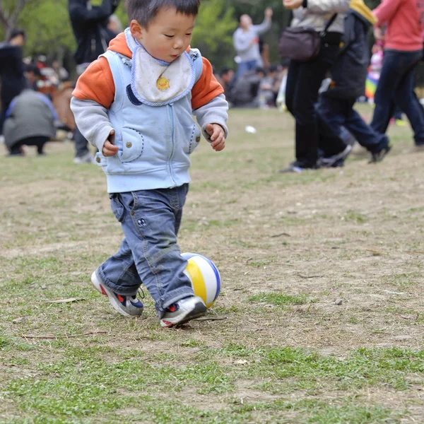 A baby playing football — Stock Photo, Image