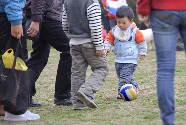 A baby playing football — Stock Photo, Image