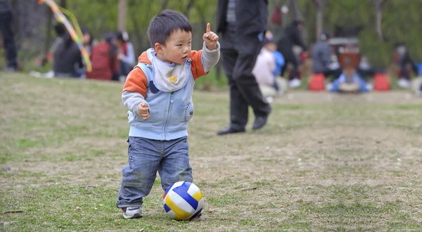 Cute baby playing football — Stock Photo, Image