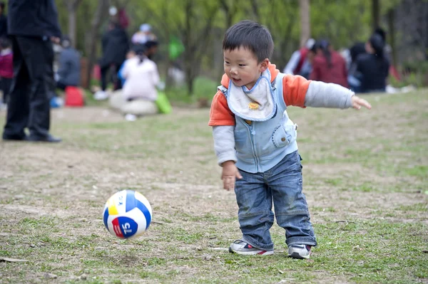 Baby playing football — Stock Photo, Image