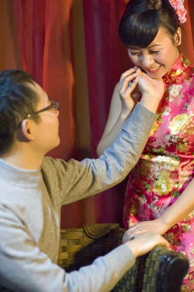 An affectionate young couple embracing before their wedding day — Stock Photo, Image