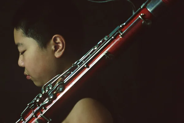 Portrait of a bassoon boy in practice — Stock Photo, Image