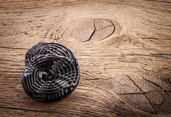 Liquorice candy on wooden table, closeup — Stock Photo, Image