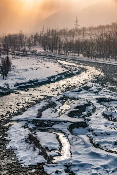 Snow-filled farm villages and rivers on the way from Srinagar to Sonmarg and Gulmarg