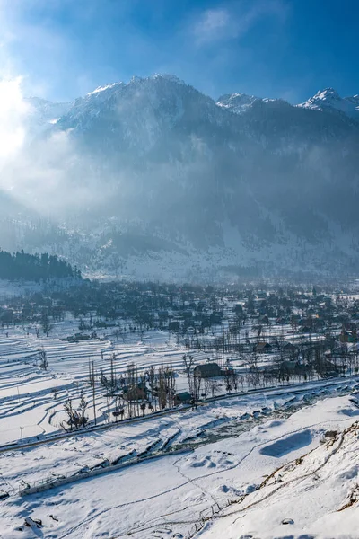 Snow-filled farm villages and rivers on the way from Srinagar to Sonmarg and Gulmarg