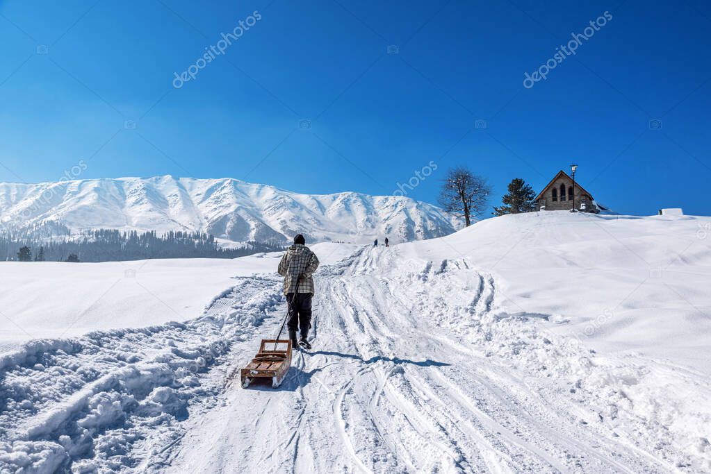 Local Kashmiri driving sledge in winter season, Gulmarg, Kashmir