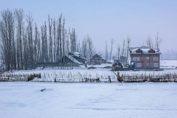 Snow-filled farm villages and rivers on the way from Srinagar to Sonmarg and Gulmarg