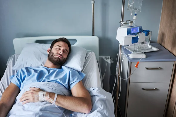 Young Man Attached Intravenous Drip Lying Asleep Bed Hospital Room — Stock Photo, Image