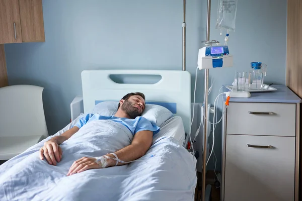 Young Man Lying Asleep Hospital Bed Intravenous Drip Running His — Stock Photo, Image