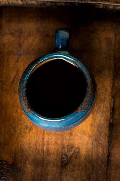 Coffee in grunge blue clay cup — Stock Photo, Image