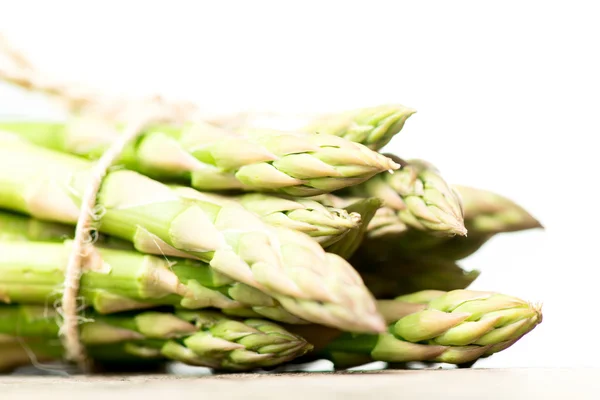 Asparagus on wooden table — Stock Photo, Image