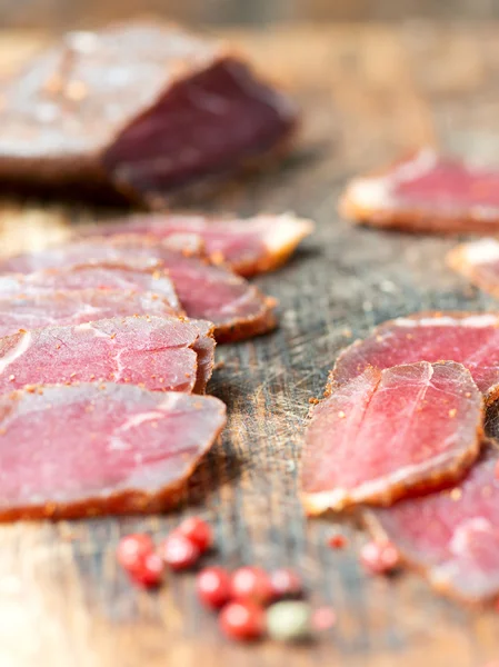 Slices of cured meet and pepper — Stock Photo, Image