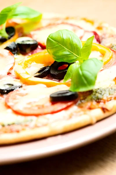 Italian pizza on wooden table — Stock Photo, Image