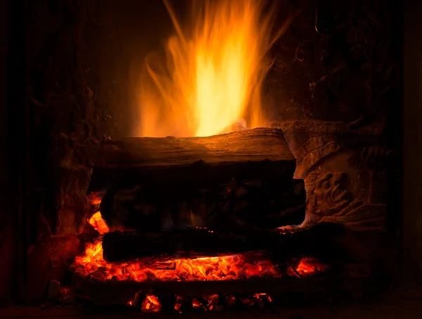 Burning fireplace with firewood — Stock Photo, Image