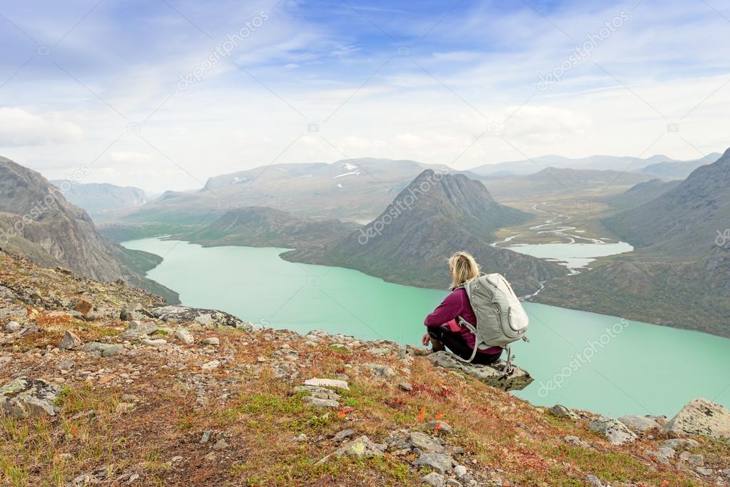 Hiker relaxing on cliff