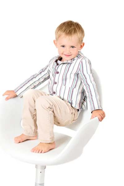 Boy v košili na židli — Stock fotografie