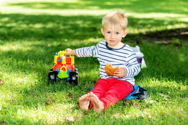 Preschool boy with toy car — Stock Photo, Image