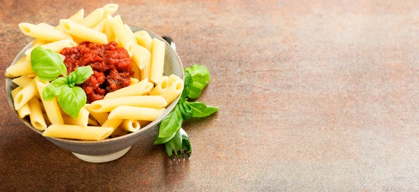 Penne pasta with a tomato bolognese beef sauce — Stock Photo, Image