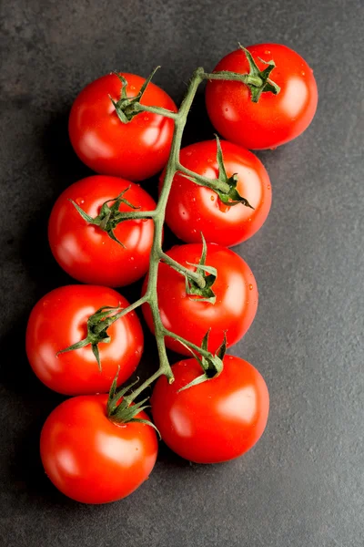 Tomatoes on dark — Stock Photo, Image