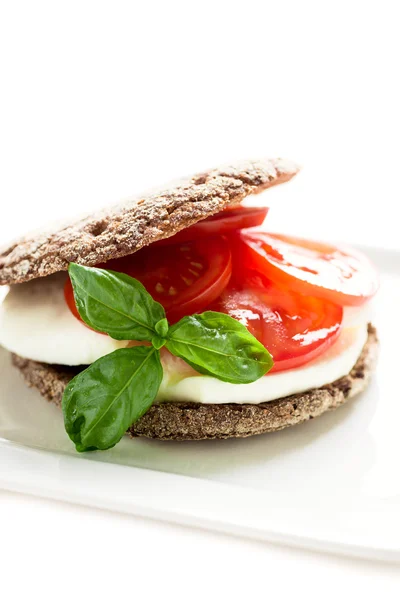 Sandwich with mozzarella tomatoes and rye bread — Stock Photo, Image