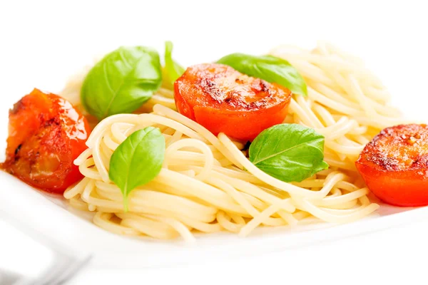 Traditional italian macaroni pasta with grilled tomato and orega — Stock Photo, Image