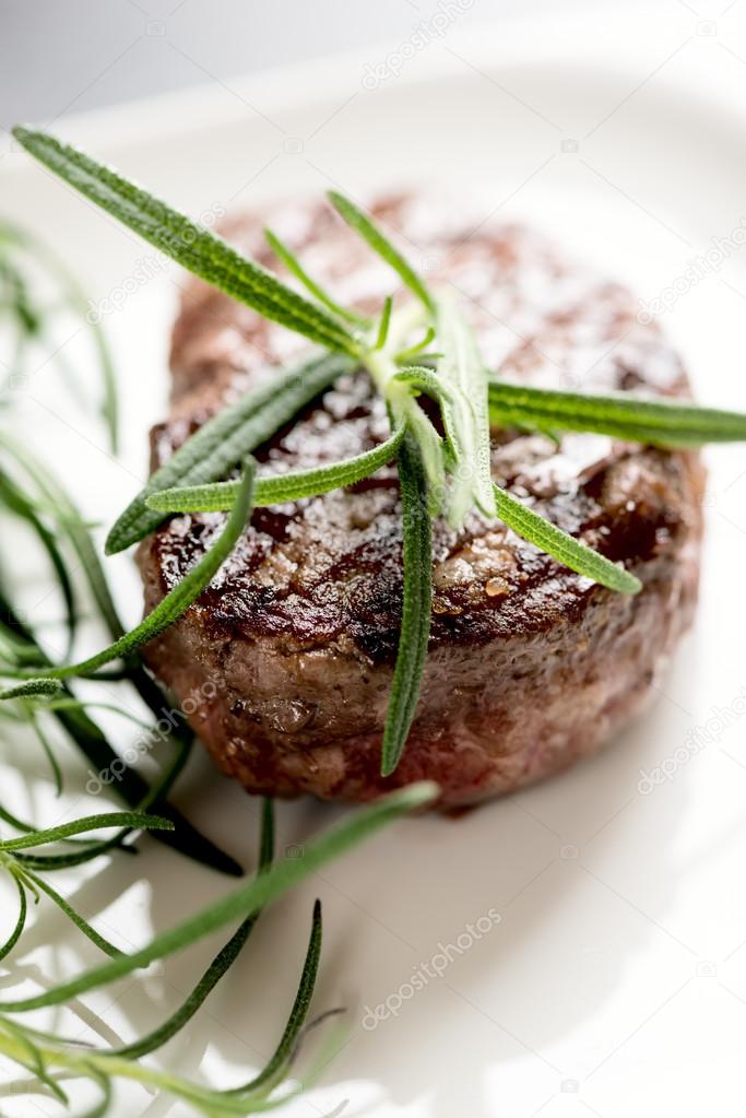 Grilled steak with rosemary