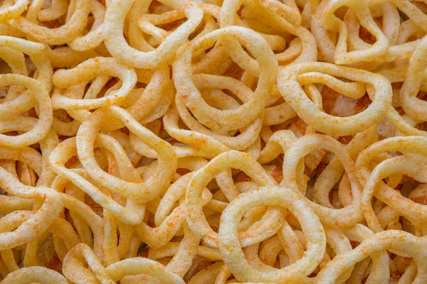 Round chips with paprika in the form of rings. — Stock Photo, Image