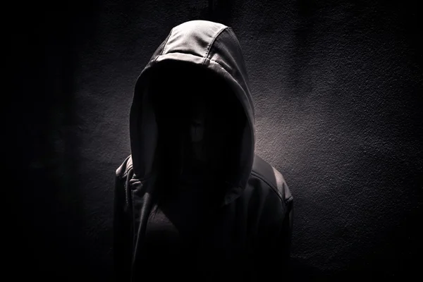 Woman wearing hoodie hiding in the dark,Scary background for book cover — Stock Photo, Image