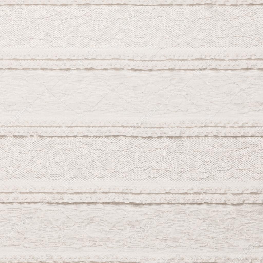 Ivory lace fabric on white background