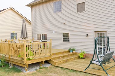 New above ground deck and patio of family home clipart